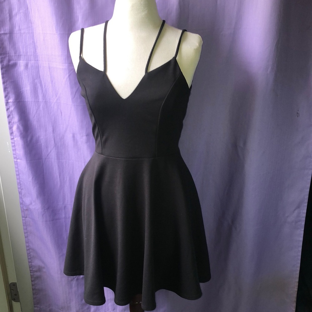 Sexy all black a must have iconic dress . Large stretchy